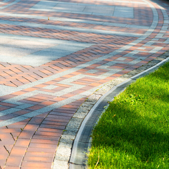 Pavement,Tile,With,Drainage,And,Shorn,Grass,In,Landscape,Design